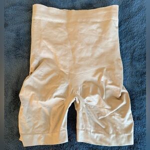 Spanx mid-thigh nude color size M with butt pockets